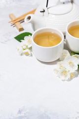Obraz na płótnie Canvas japanese tea ceremony. green tea with jasmine, vertical
