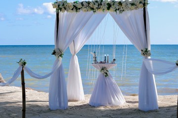 wedding dress on the beach bride and groom holding hands wineglass wedding dress bride love married window