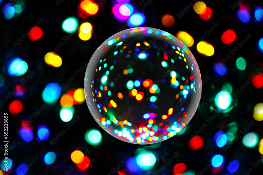 Poster lens ball macro refraction abstract with multicolored bokeh lights on black