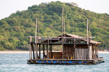 Floating raft house in the sea. Marine attractions