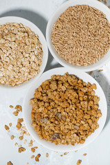 range of products made from oats on white background, vertical
