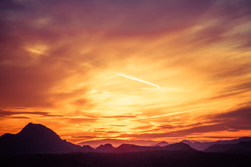 Vivid sunset over the mountains and desert of the Sonoran Desert in Arizona.