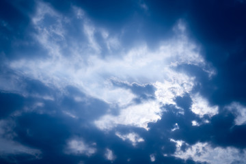 Fototapeta premium The blue summer sky with white fluffy clouds. Photo from window on the airplane.