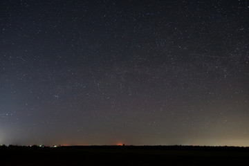 Fototapeta premium A starry night over a farmers field