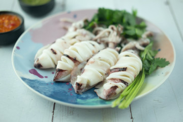Steamed Squids or Octopus served with spicy seafood sauce chili.