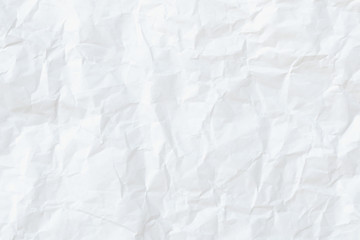 Naklejka premium Modern crumpled white paper on empty sheet gray background with light shadows for creative wallpaper, card, art work design.