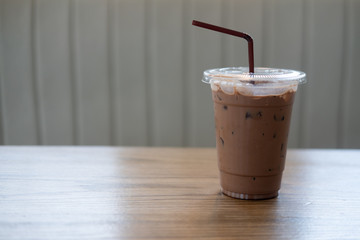 Cold Mocha coffee in plastic cup at cafe.