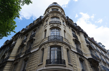 Obraz premium Traditional French house with typical balconies and windows. Paris.