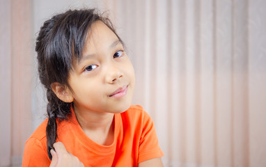 Cheerful little cute girl smiling and looking at camera, Happiness kid concept