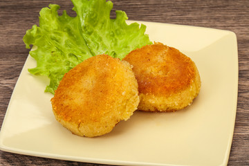 Vegan cuisine - Potato cutlet in the plate