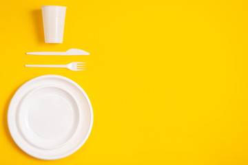 plastic spoon on a yellow background