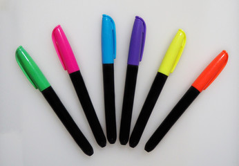 Multicolored highlight pen set on a white background