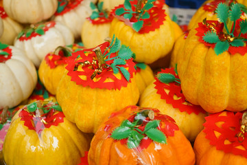 Pumpkin. Gold and silver pumpkins decorated for festive, During Chinese festival, they are used at the altar as religious offerings.