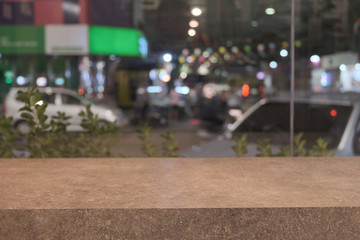 Blank wooden floor in cafe with blur city light background