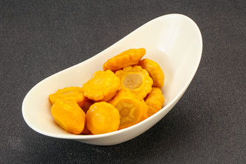 Marinated yellow patisson in the bowl