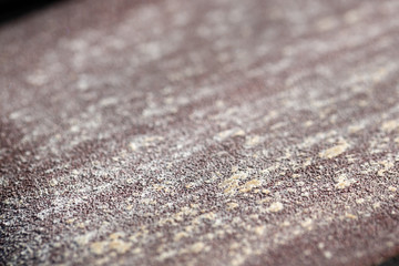 Macro close up on a clogged sand paper 