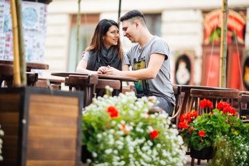 young couple posing on city background, travel concept