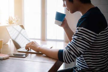 Cropped shot of a serious asian businessman thinking and concentrating monitoring on laptop screen.