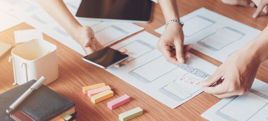 Cropped shot of creative UX UI designers team designing, Developing mobile application from...