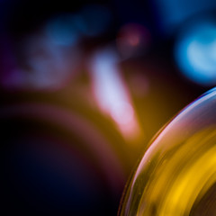 Macro shot of glass of light bulb on colorful abstract background