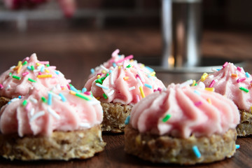 Homemade small desserts with pink forsting 