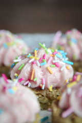Homemade small desserts with pink forsting 