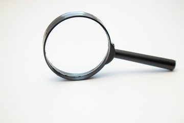 Close up black magnifying Glass on white background