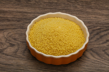 Raw cous cous heap in the bowl