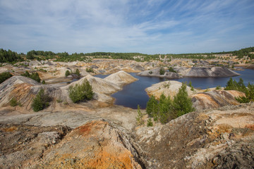 Amazing kaolin clay marsian landscape quarry open pit at summer day