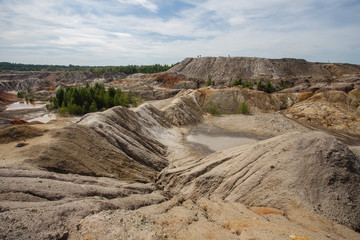 Amazing kaolin clay marsian landscape quarry open pit at summer day