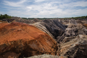 Amazing kaolin clay marsian landscape quarry open pit at summer day