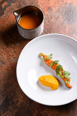 Bowl of gourmet soup with carrot