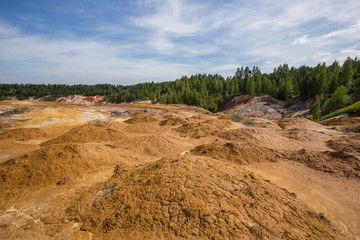 Amazing kaolin clay marsian landscape quarry open pit at summer day