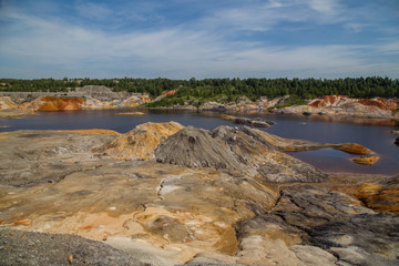 Obraz premium Amazing kaolin clay marsian landscape quarry open pit at summer day