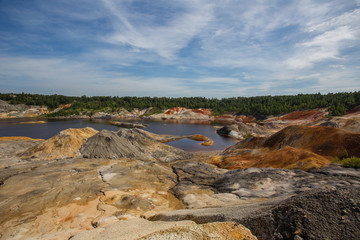 Amazing kaolin clay marsian landscape quarry open pit at summer day