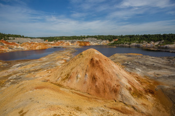 Amazing kaolin clay marsian landscape quarry open pit at summer day