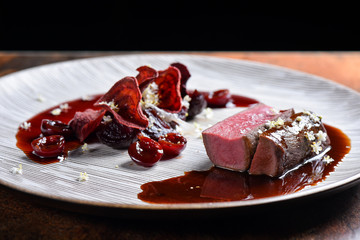 Fine dining Venison Steak with Cherries and Port Sauce