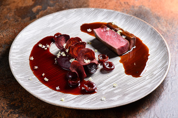 Fine dining Venison Steak with Cherries and Port Sauce