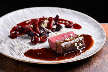 Fine dining Venison Steak with Cherries and Port Sauce