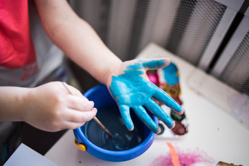 Child development. Creativity with paints in quarantine. Handprints
