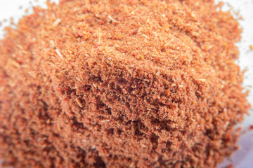 Background with scattered ground cinnamon at high magnification