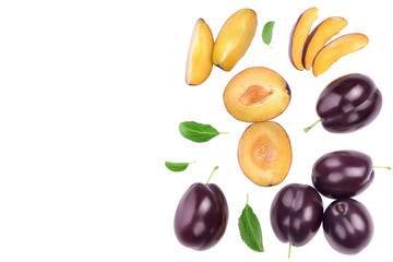 fresh purple plum and half with leaves isolated on white background with clipping path and full depth of field. Top view. Flat lay