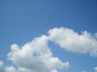 Fototapeta premium Bright blue sky with clouds on a summer day