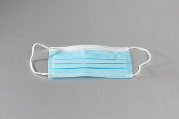 Protective medical masks on a gray background