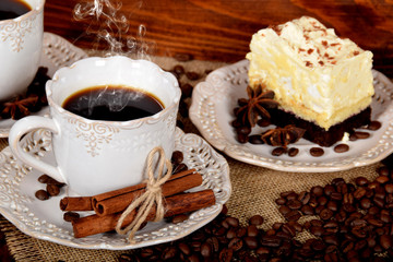 retro cups with hot coffee and a cookie with vanilla chocolate cream