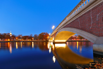 Dunster House and John Weeks Bridge on campus of Harvard University at sunset. Harvard University...