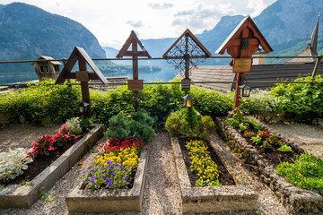 Graves overlooking Lake Hallstatt at the cemetery surrounding the Roman Catholic Parish Church of...