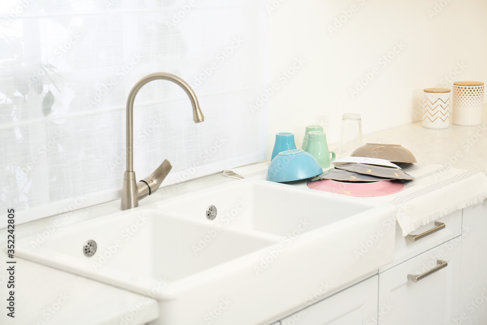 Sticker Clean dishes drying on counter in kitchen