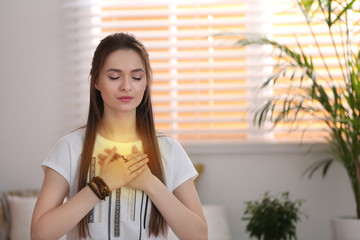 Young woman during self-healing session in therapy room