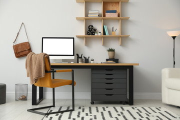Stylish room interior with modern comfortable workplace